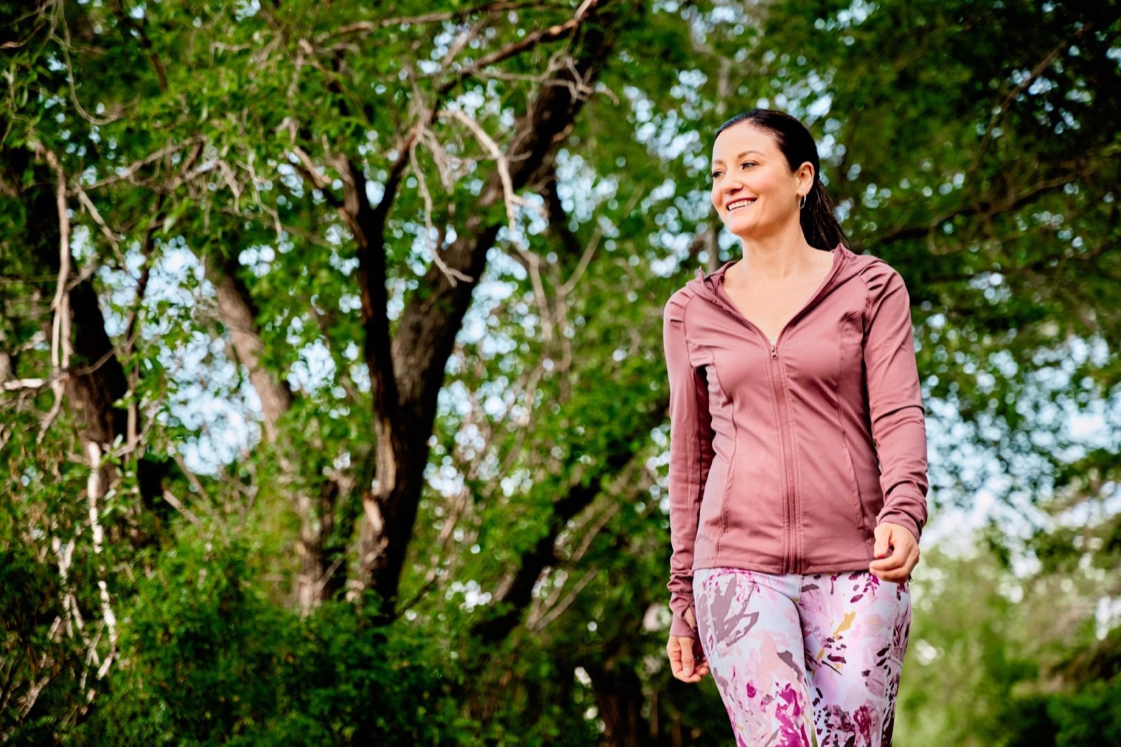 April out for a walk among green trees